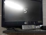 a flat screen tv sitting on top of a shelf