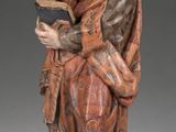 an image of a statue of a man holding a book