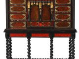 a black and red cabinet with drawers and drawers on it