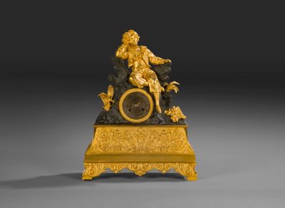 Pendule en bronze ciselé et doré à sujet inspiré de Paul et …