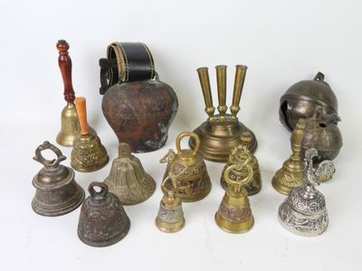 many different types of bells on a white surface