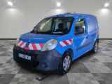 a blue van with red and white stripes parked in a room