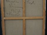 an easel with a piece of cardboard on top of it with writing on it