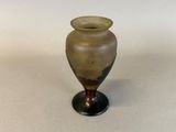 a small vase that is sitting on a table