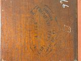 an image of a picture of a wooden box with a stamp on it