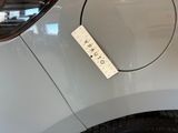 a picture of a car with a sticker on the side of it