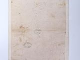 a piece of paper with writing on it sitting on top of a table