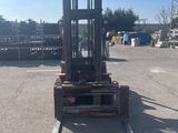 a picture of a forklift in a parking lot