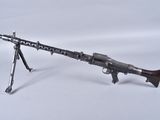 a toy gun with a wooden barrel on a white background