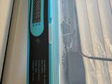 a blue and black electronic device sitting on a counter