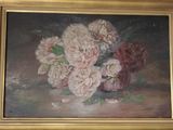 une photo d'un tableau de fleurs dans un cadre doré