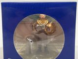 a box with a toy figurine of a man riding on a horse
