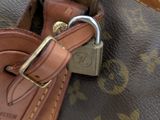 a close up of a purse with a key in it