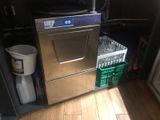 an image of a dishwasher in the corner of a kitchen