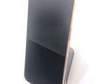 a cell phone that is sitting on top of a stand