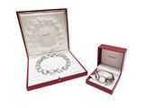 a red box with a silver bracelet and a red box with a silver bracelet
