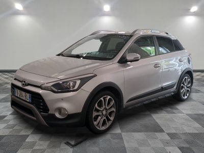a picture of a silver car parked in a garage