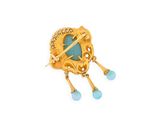 a close up of a gold broochle with blue stones