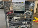 a cart with a lot of items in it in a warehouse