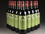 six bottles of red wine are lined up in a row