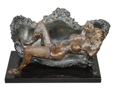 statue of a woman laying on a chair with a mirror in the background