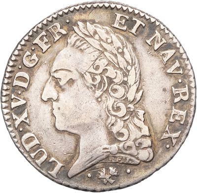 une pièce d'argent portant l'image d'une tête de femme