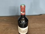 a bottle of wine that is sitting on a table