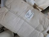 a pile of bags with a price tag on them