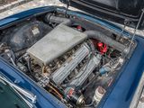 a small engine in the hood of a blue car