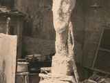 an old photo of a sculpture in a studio