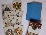 many cards and a blue case on a table