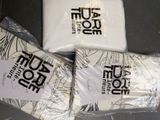 three bags of toilet paper sitting on top of a table
