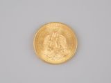 an image of a close up of a gold coin on a white surface