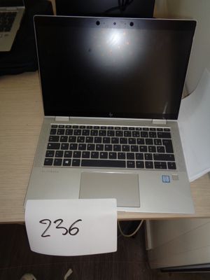 a laptop computer sitting on a desk with a price tag attached to it
