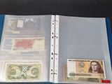 a close up of a binder with a lot of money inside of it