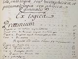 an old book with writing on it sitting on a table