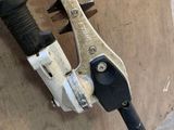 a close up of a pipe cutter attached to the side of a building