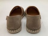 pair of tan sued espadrills on white surface