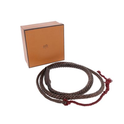a close up of a bracelet and a box on a white background