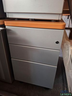 a refrigerator and a refrigerator freezer in a room