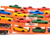 many toy cars that are sitting on top of each other