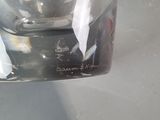 a glass of water with a piece of paper sticking out of it