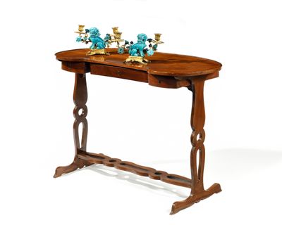 a wooden table with two candles on top of it
