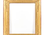 an old picture frame with a white background and a gold border