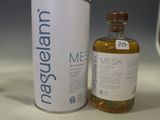 a bottle of liquid next to a canister of liquid