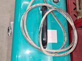 a blue box with a cord attached to it next to a red box