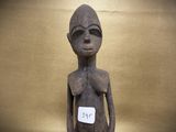 statue of a woman with a tag on her chest