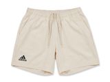 un short blanc avec un logo noir sur le côté