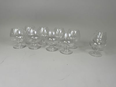 several empty wine glasses sitting on top of a white table
