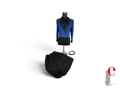 a blue jacket and black pants on a mannequin